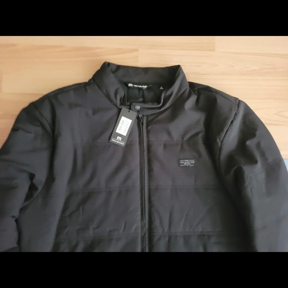 Brand new Travis Matthew interlude puffer jacket